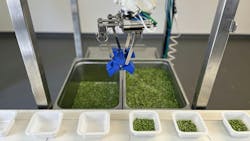 Chef Robotics Food Assembly Robot close-up on end effector handling food Chef Robotics Food Assembly Robot close-up on end effector handling food
