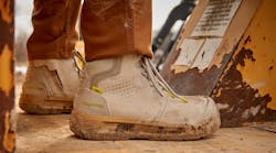 Close-up of Grey Xtend Safety Boots being worn in outdoor, dusty environment. Close-up of Grey Xtend Safety Boots being worn in outdoor, dusty environment.