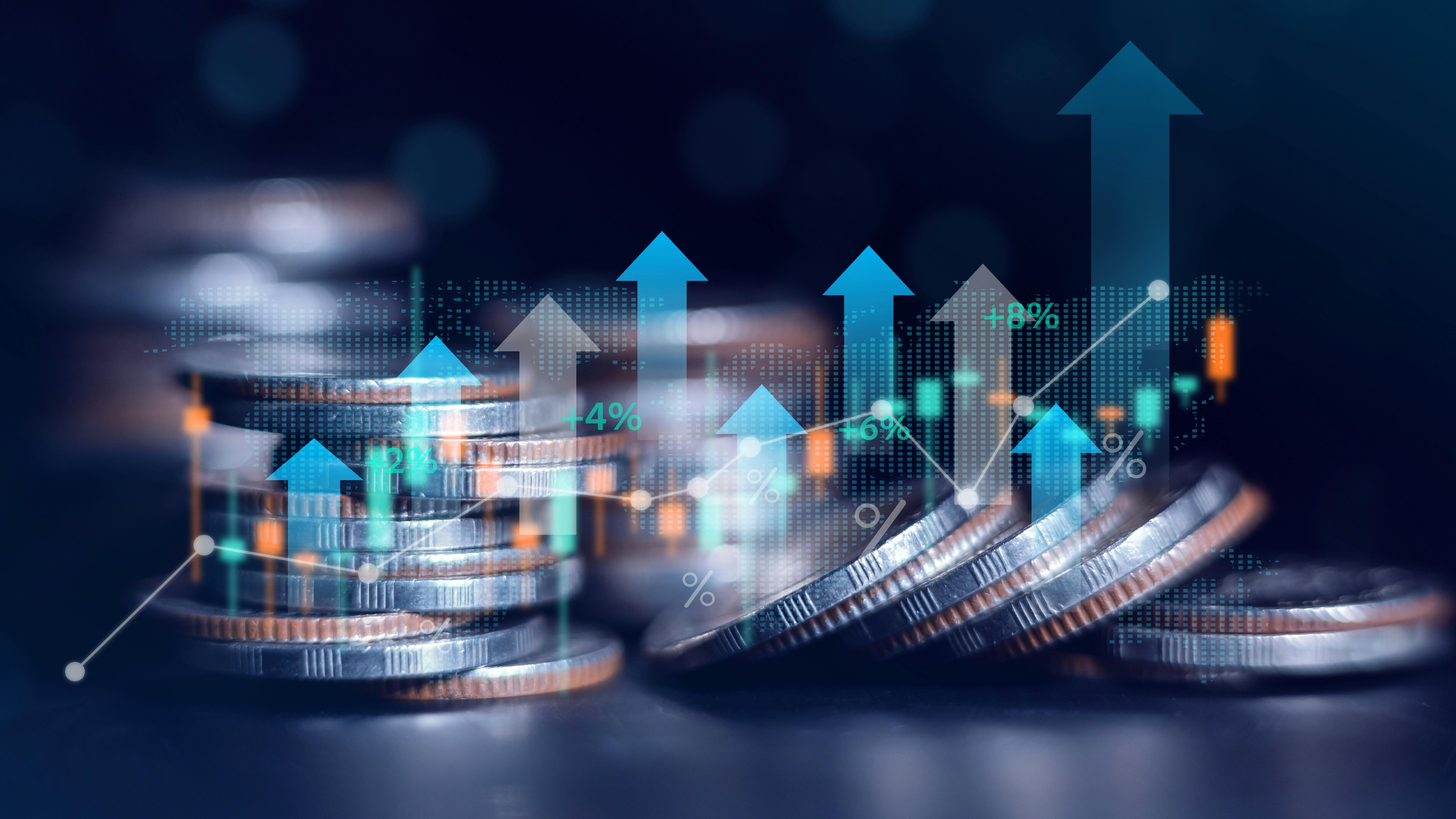 Business finance and investment concept with stock chart and stacked coins.