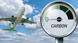 Gauge with inscription CARBON and arrow points to zero on a background of plane in sky. Gauge with inscription CARBON and arrow points to zero on a background of plane in sky.