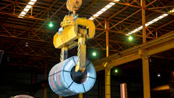 An overhead crane carrying a steel coil An overhead crane carrying a steel coil