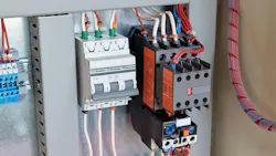 Circuit breaker, contactor, or starter with additional contacts and a thermal relay in an electrical cabinet. Circuit breaker, contactor, or starter with additional contacts and a thermal relay in an electrical cabinet.