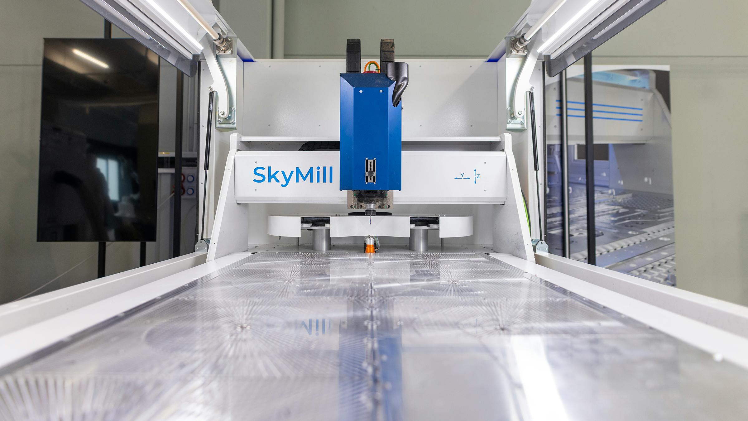 SkyMill Compact CNC Mill Holds Plates on 8-Zone Vacuum Table
